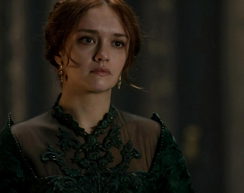 a still from "house of the dragon" depicting its deuteragonist, alicent, dressed lavishly in green